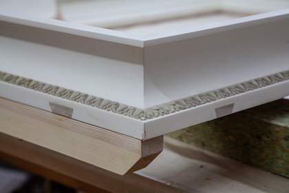 Photo showing where the mitre key is cut into a slot on the reverse of the frame, and the build-up and a line of composition ornament pressed from an original boxwood mould
