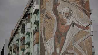Vidokle film still of a mural on a building 