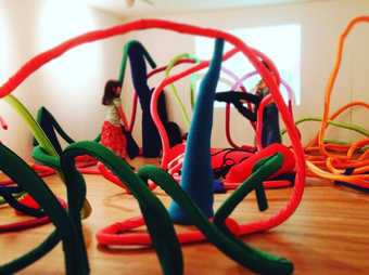 Kids with curly bendy sculptures