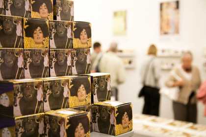 Customers and Tate products in the Shop at Tate Liverpool