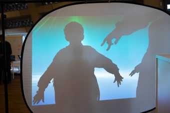Primary school pupil creating shadow performance at London CLC at Tate Exchange