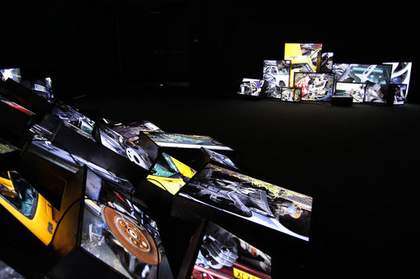 Zined Sedira Dead End 2010 light boxes of variable sizes stacked against one another in a dark room