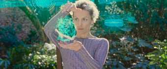  a woman holding a holographic projection