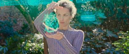 a woman holding a holographic projection