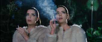Twin sisters smoking