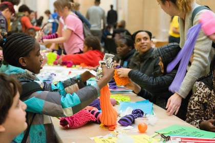A group of children and artists make colourful soft sculptures in Tate Britain
