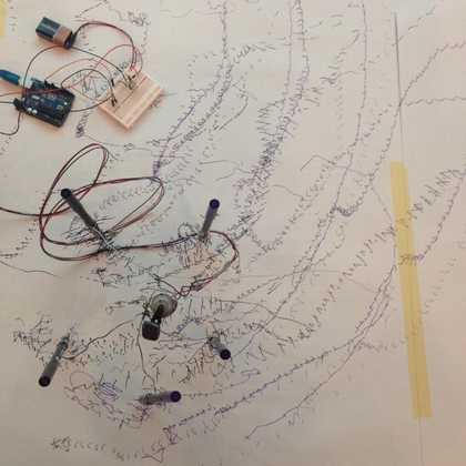 Ariel view of the results and equipment made on the digital makers drawing workshop, showing sketchy lines and battery circuits
