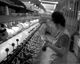 1 Darcy Lange A Documentation of Bradford Working Life, UK (The Second Situation: Whiteheads Woollen Mills, 4th Study: Spinning—Theresa Hird) 1974, photographic still. Courtesy Govett-Brewster Art Gallery and Darcy Lange Estate