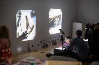 Child playing with a projector