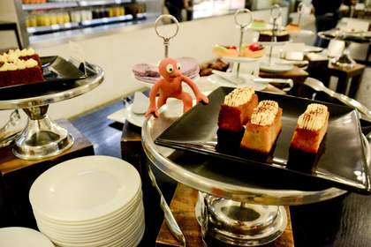 Morph stealing some cake in cafe