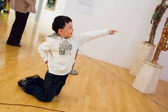 Child exploring the gallery