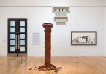 Installation view of Edward Allington and Pablo Bronstein showing a pillar and an architectural picture on the gallery wall