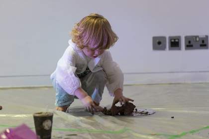 photograph of child taking part in the workshop 'Under 5s Explore: The Elements'