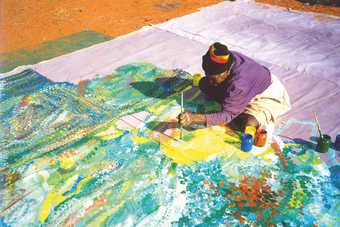 Emily Kame Kngwarreye painting Earth's Creation I in the Utopia region, Central Australia, 1994