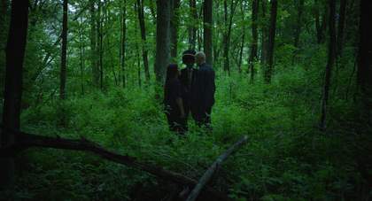 Three people in the forest