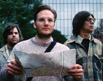 Redmond Entwistle Monuments 2010 film still showing a man holding a map