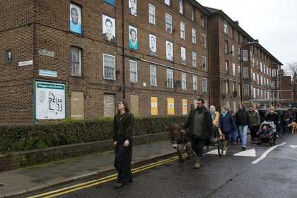 People process down an industrial space