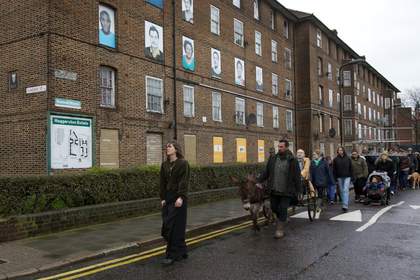 People process down an industrial space