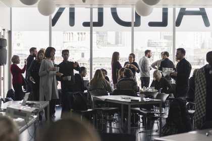 Attendees in conversation during a breakout session