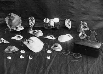 Selection of items used to disguise facial injury during the First World War and early development of plastic surgery; the original caption reads: ‘Repairing war’s ravages: renovating facial injuries’, c1914–8