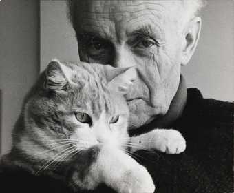 Ben Nicholson holding his cat Tommy