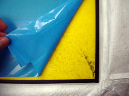 Peeling back low-tack film, to find broken glass