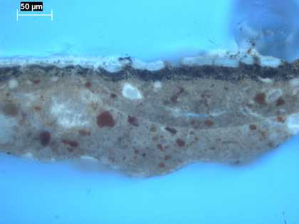 Fig.11 The same cross-section as fig.10, photographed in ultraviolet light, showing the microcissing in the black paint