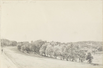 A country scene showing a curving, tree-lined path on the left, a bridge on the right and hills and a building in the background.