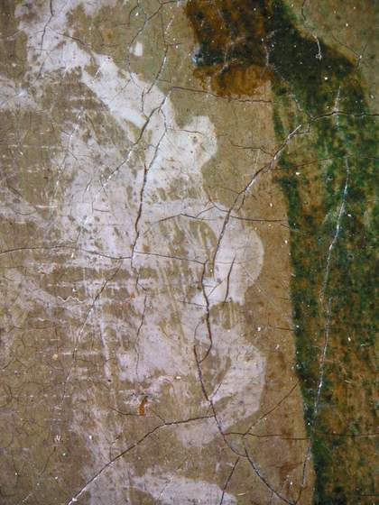 Fig.14 Detail at x10 magnification of the apron of the middle child, showing the priming left visible as a tone in the composition