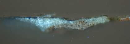 Fig.14 Cross-section through blue drapery, photographed at x160 magnification. From the bottom: mushroom coloured paint of dress; pale blue opaque bodycolour; blue glaze.