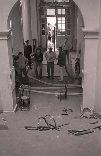 Fig.17 Centre, left to right: Klaus Rinke, Stefan Wewerka and Günther Uecker standing with Klaus Rinke’s water hose in the entrance hall of the Edinburgh College of Art during the installation of Strategy: Get Arts, August 1970
