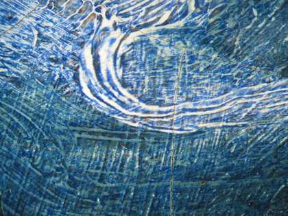 Fig.18 Detail of the blue dress at x8 magnification, showing two shades of underpaint – white and pale blue – glazed with dark blue, which contains ultramarine