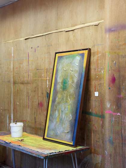 Fig.18 An unstretched, painted canvas spread out on a table in Bowling’s studio, with a paint pot and finished painting resting on its surface