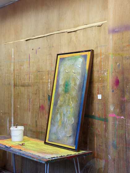 Fig.18 An unstretched, painted canvas spread out on a table in Bowling’s studio, with a paint pot and finished painting resting on its surface