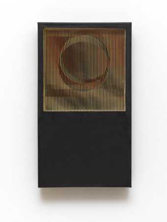 Construction of perspex, paper and board: a black vertical rectangle, with cardboard strips inserted in a square frame in the upper half, forming a circular shape