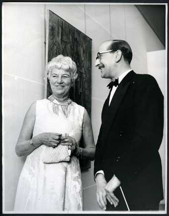 Fig.1 Peggy Guggenheim and Norman Reid at the opening of the exhibition The Peggy Guggenheim Collection, Tate Gallery, London, 1 January 1965
