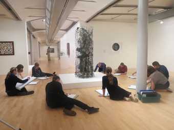 Fig.1 Workshop participants carrying out a collaborative drawing exercise in front of León Ferrari’s Tower of Babel 1963, Tate Liverpool, April 2014 © Tate