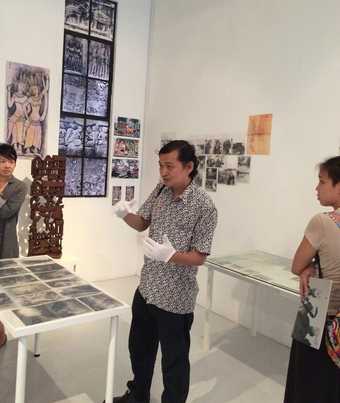 Koh Nguang How ‘performing’ his archive at Nanyang Technological University’s Centre for Contemporary Art, Singapore, October 2014