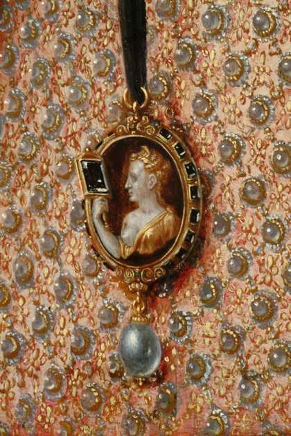 Fig.22 Detail of the patterning of the dress and the cameo brooch