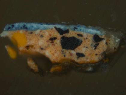 Fig.3 Cross-section through the blue dress near the sitter’s right shoulder, photographed at x320 magnification. From the bottom: salmon pink ground; opaque blue paint of dress; thin blue glaze