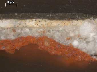 Fig.4 Cross-section through the background, photographed at x320 magnification. From bottom to top it shows: red ground; grey ground; biscuit coloured ground; dark paint of the background