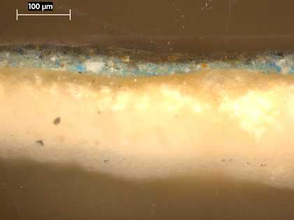 Fig.4 Cross-section through green foliage in the lower left corner, photographed at x320 magnification. From the bottom: white ground; bright, opaque bluish green underpainting; translucent green glaze