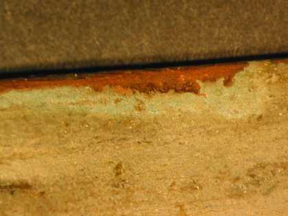 Fig.4 Detail of a small damage at the top edge, showing bright turquoise blue underpaint beneath the paler blue of the sky