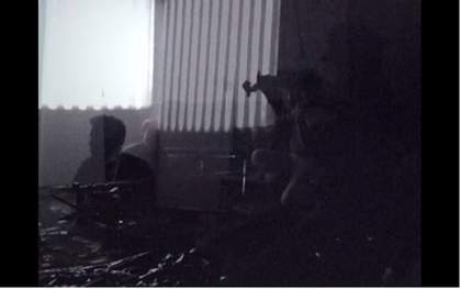 Still from Tyler Hubby’s film of the performance of Ten Years Alive at the Empty Bottle, Chicago, 1996, showing the musicians playing their instruments