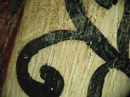 Fig.6 A tiny loss of paint in the white sleeve, showing reddish brown underpainting at the base of the paint loss