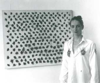 Fig.6 A model wearing Henk Peeters’s pyrography shirt while standing next to 60–13 1960, Galerie Coumans, Utrecht, 1987