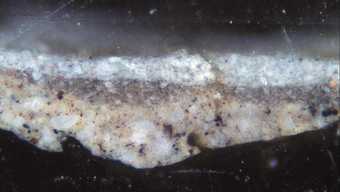 Fig.7 Cross-section through the sky, photographed at x320 magnification. From the bottom: buff-coloured ground; grey underpainting; blue sky