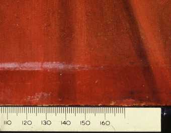 Fig.8 Crimson glaze in the red dress at the bottom edge, unfaded where normally protected by the rebate of the frame