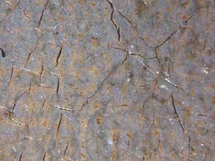 Fig.9 Microphotograph taken at x8 magnification of blue glazes over opaque paint in the frock