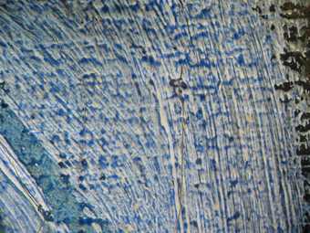 Fig.9 Blue glaze over two opaque shades of blue in shoulder, photographed at x8 magnification